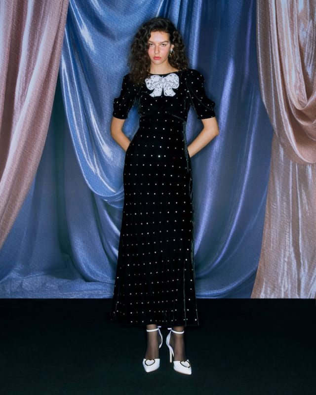 “Tish” dress from #SretsisFW24 in “Heart Sparks” velvet with guipure lace bow detail and Chantilly lace insert on the back. Shop the look at Sretsis Boutiques.